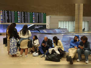 Passengers wait at Ben Gurion Airport near Tel Aviv, Israel, on October 7, 2023, as flights are canceled because of the Hamas surprise attack.